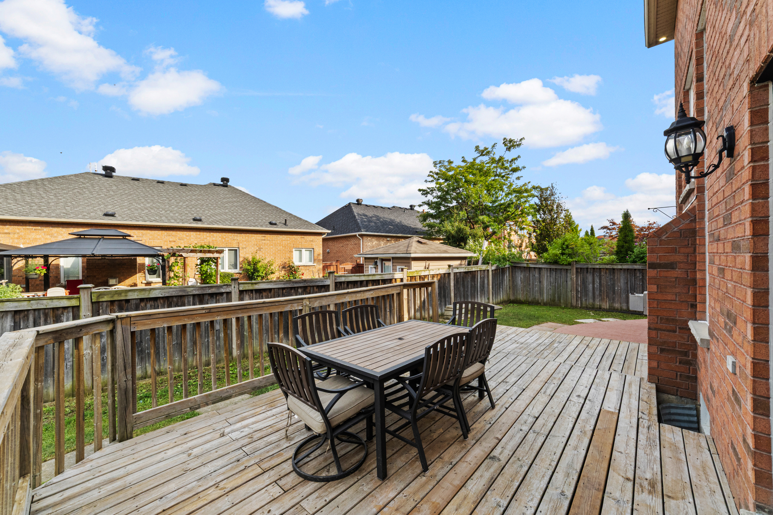 Backyard deck with outdoor seating in a GTA home